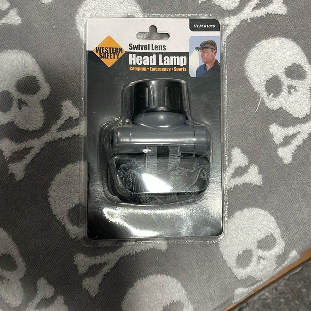Swivel lens head lamp new in pkg